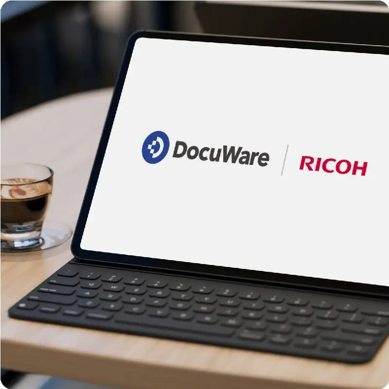 Laptop screen showing Docuware and Ricoh logos